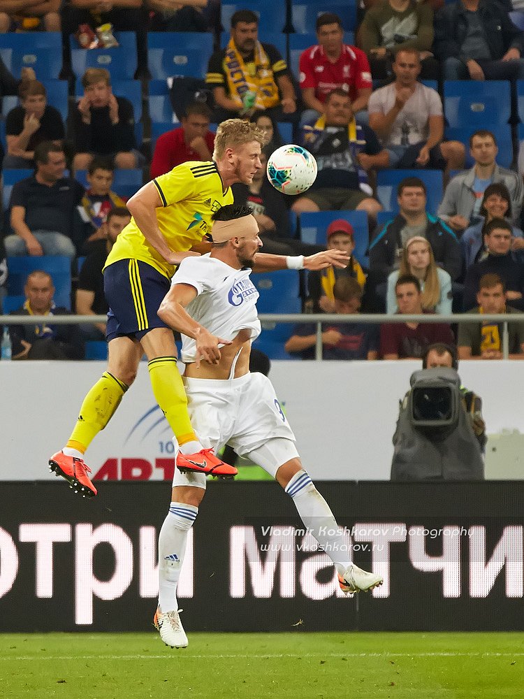 Arseny Logashov of FC Rostov vies for the ball